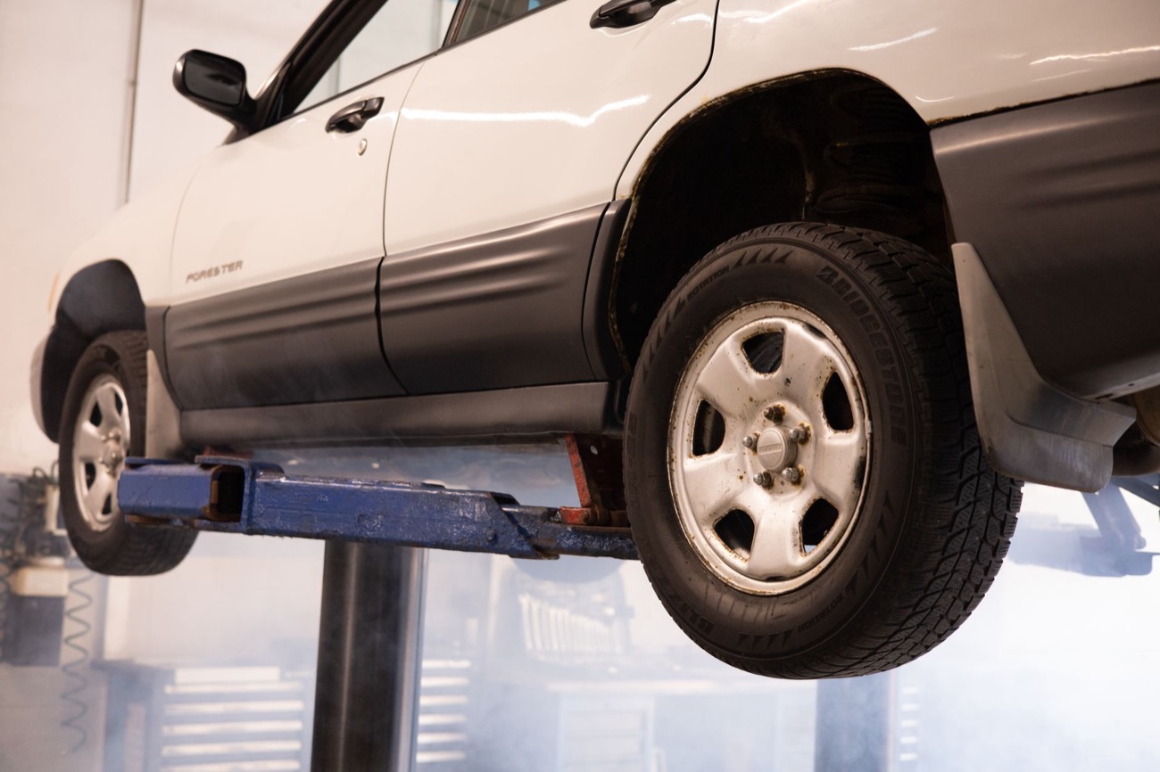 A vehicle up on a Brooks Motor Works lift